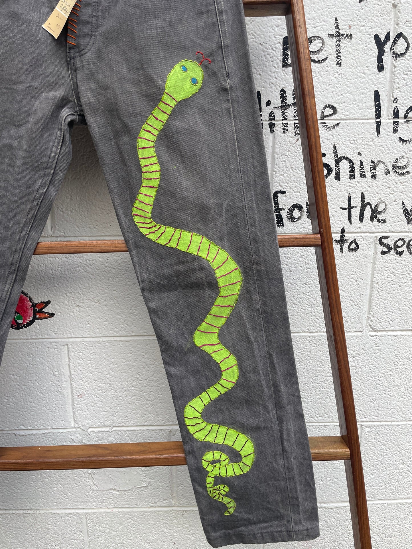 Tripp's Store : Bespoke one of a kind embroidered hand stitched patched gray jeans // Unisex Sizes 32 X 31 // Grey boho painted jeans