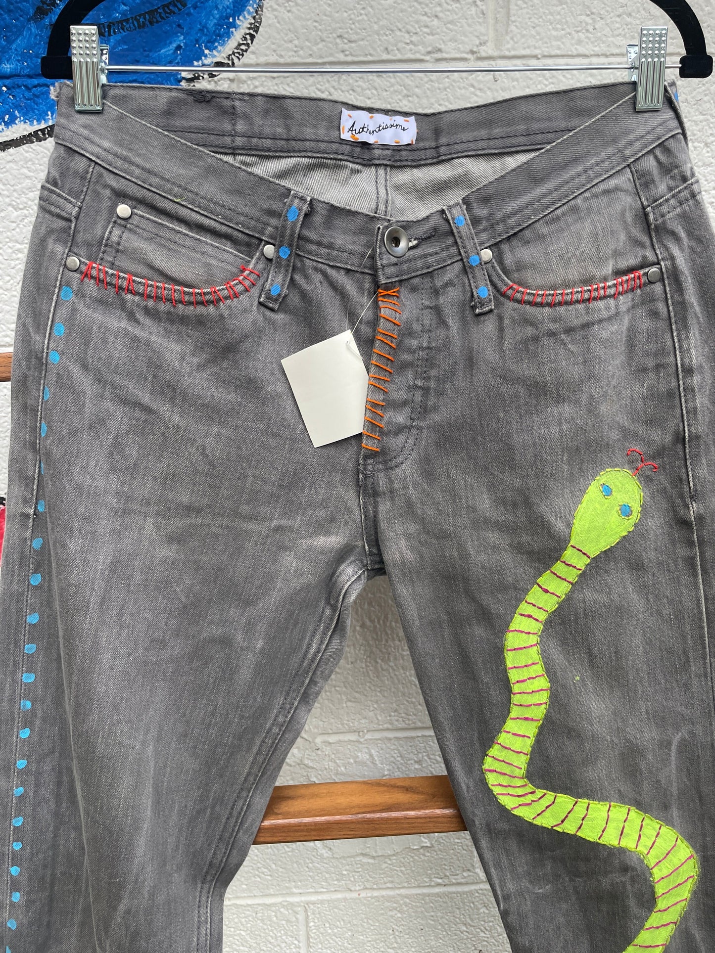 Tripp's Store : Bespoke one of a kind embroidered hand stitched patched gray jeans // Unisex Sizes 32 X 31 // Grey boho painted jeans