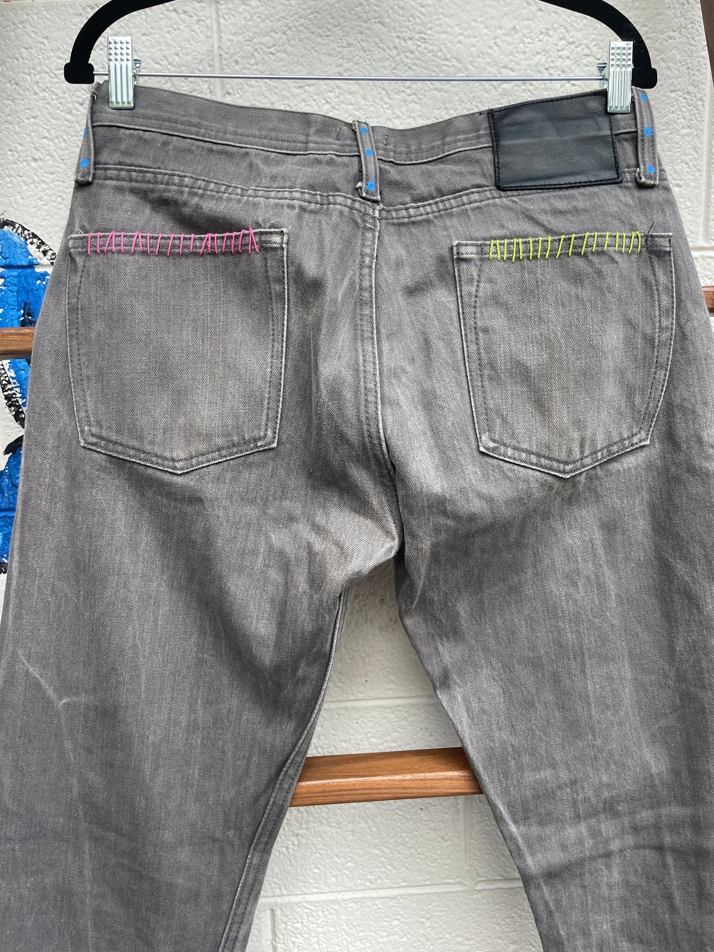 Tripp's Store : Bespoke one of a kind embroidered hand stitched patched gray jeans // Unisex Sizes 32 X 31 // Grey boho painted jeans